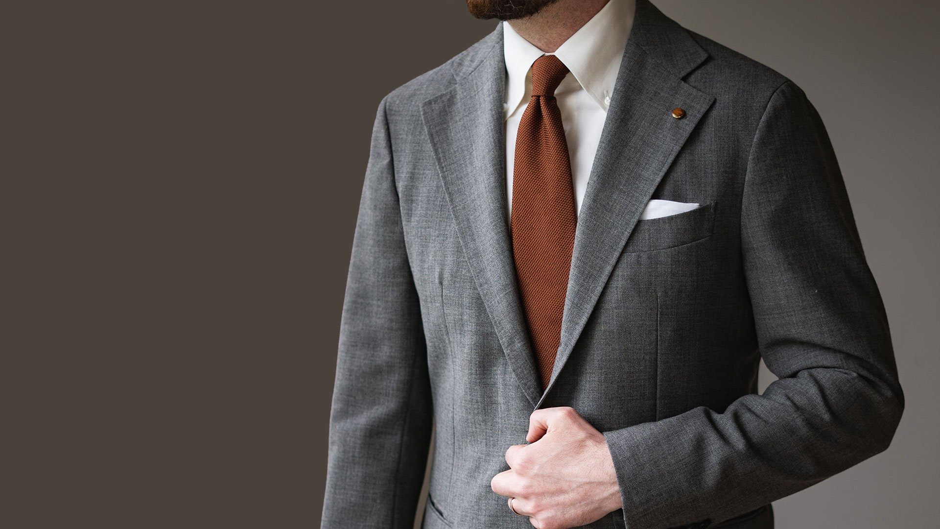 Grey Suit With A Burnt Orange Tie