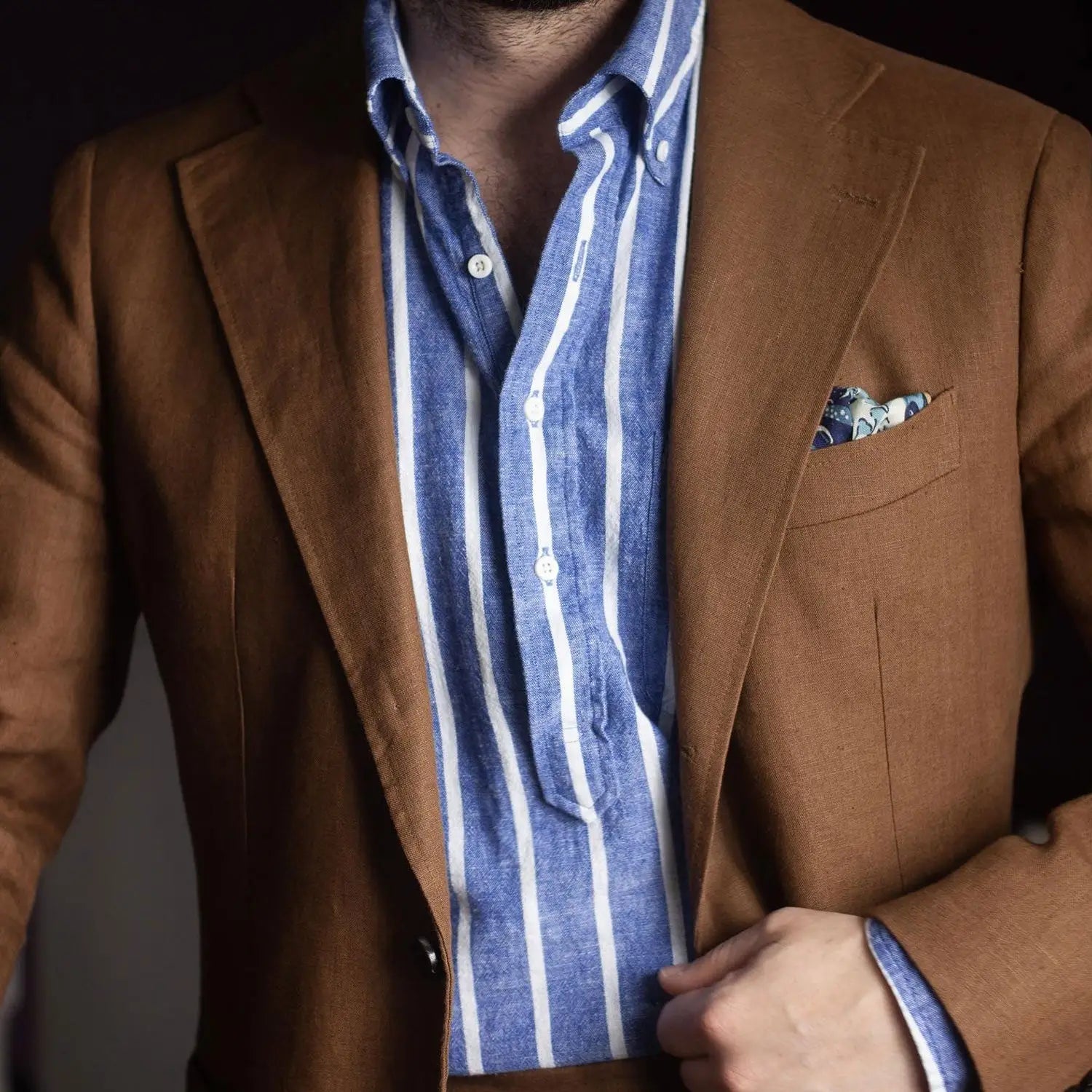 Brown suit jacket with striped shirt ideal for stylish office outfits to stay cool