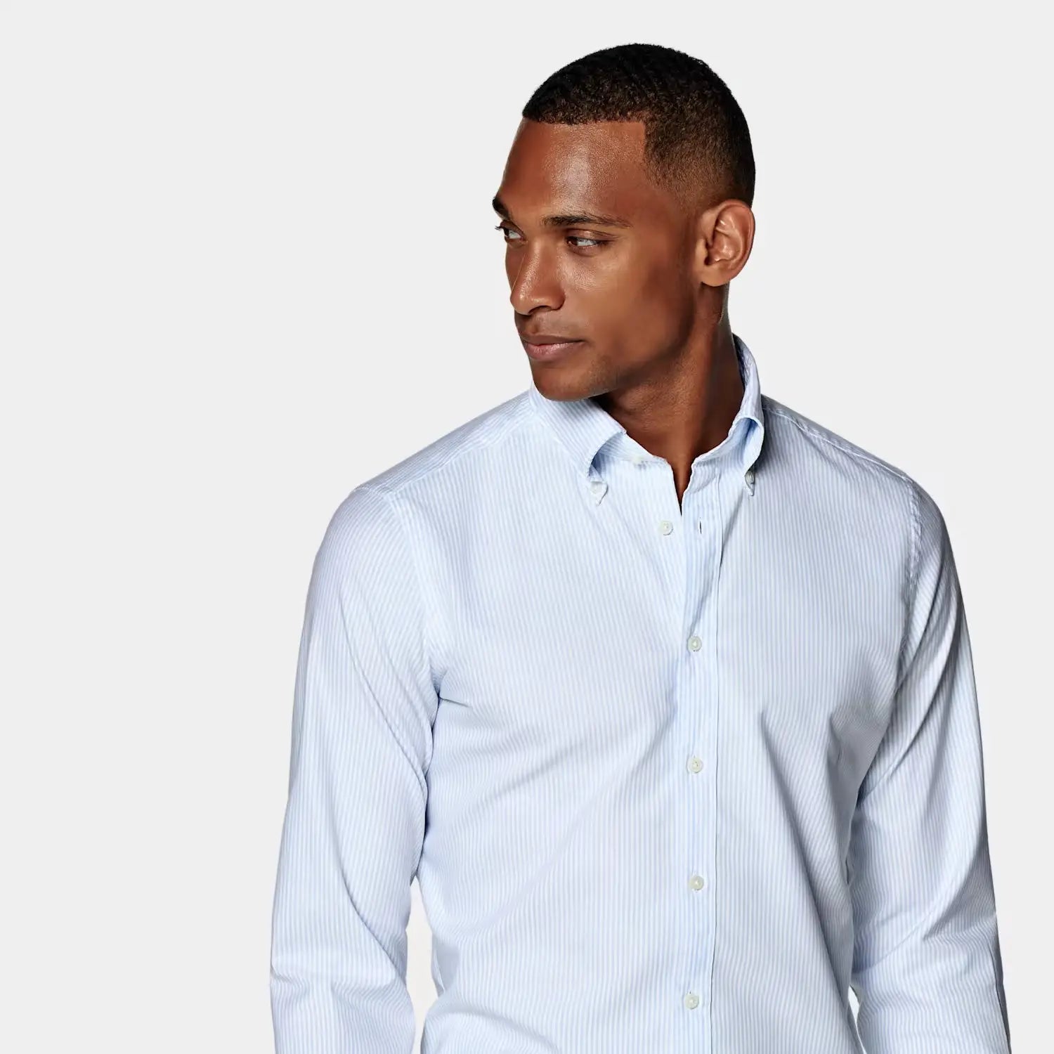 Light blue striped dress shirt ideal for office outfits to stay cool and confident