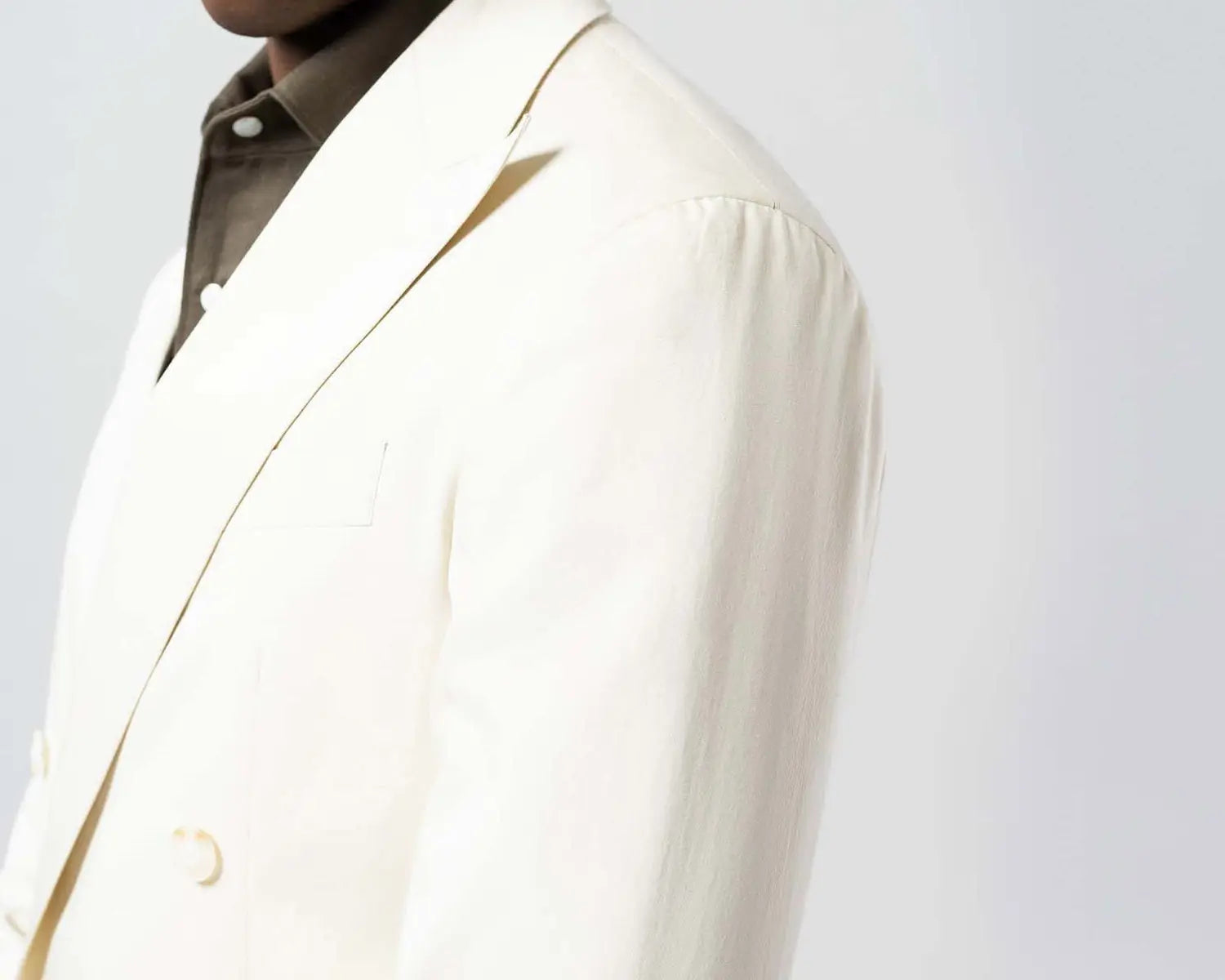 Cream-colored double-breasted blazer as a stylish wedding suit for the wedding day event