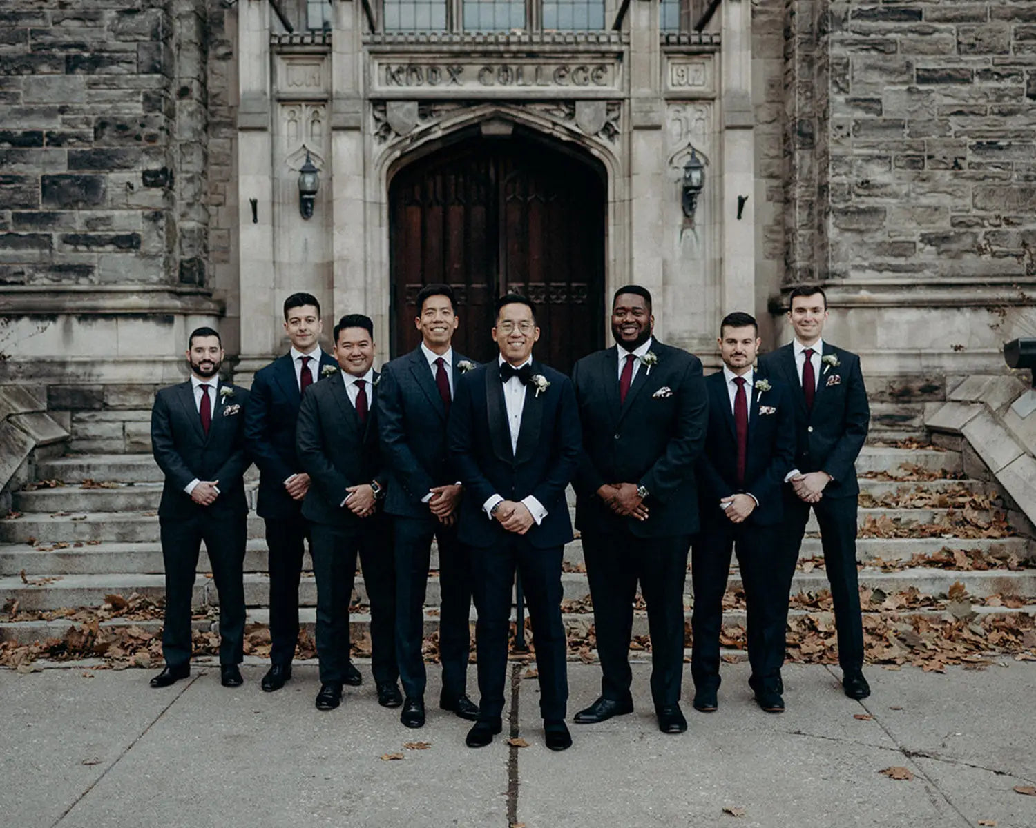 Groom and groomsmen in suits with dress shirts for a wedding day celebration