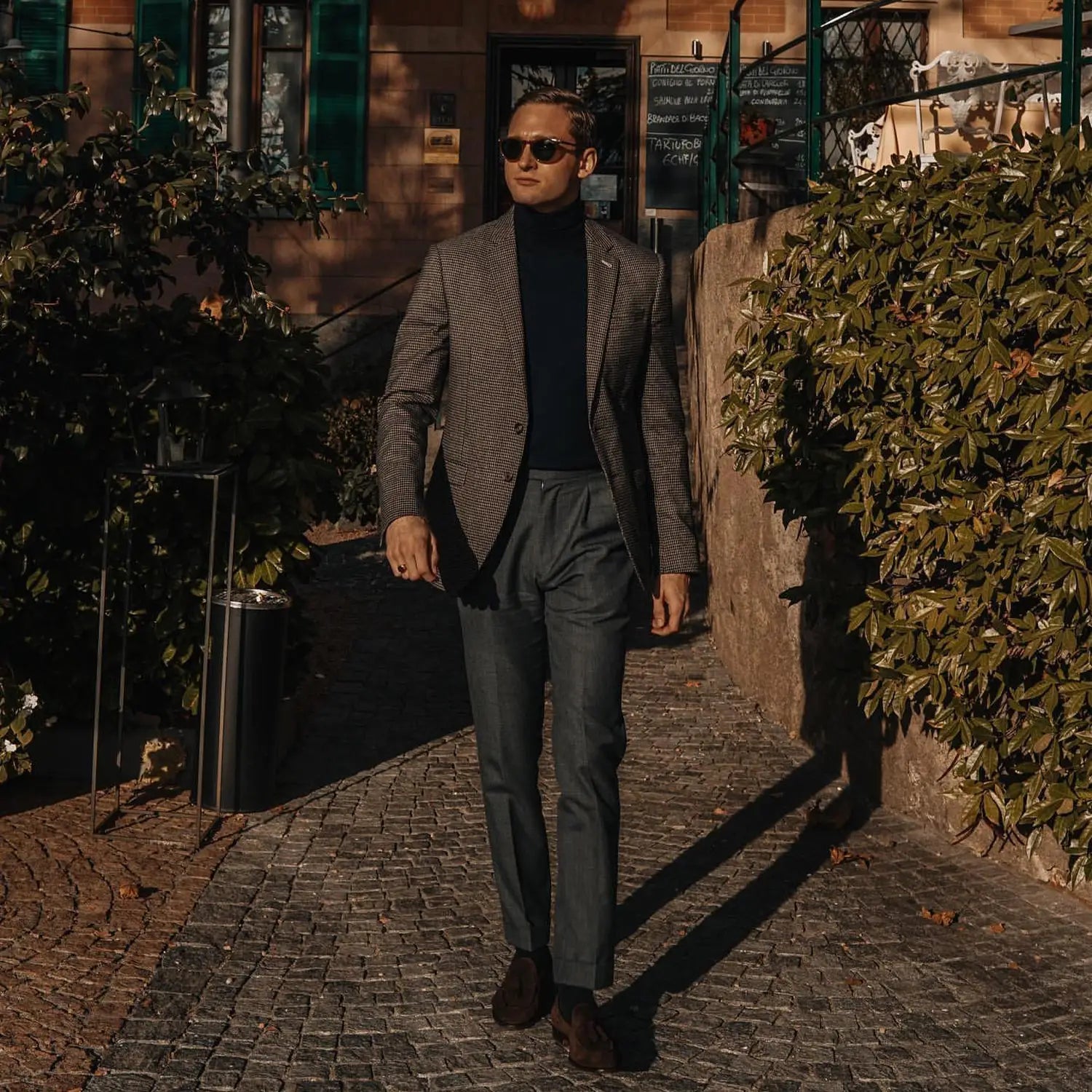 Stylish man in suit highlighting small details for a systems check to avoid a poor outfit