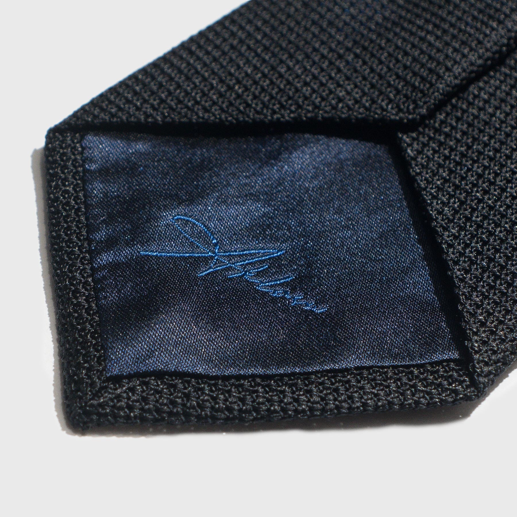 Black Grenadine Tie Made in Italy showing Aklasu Logo