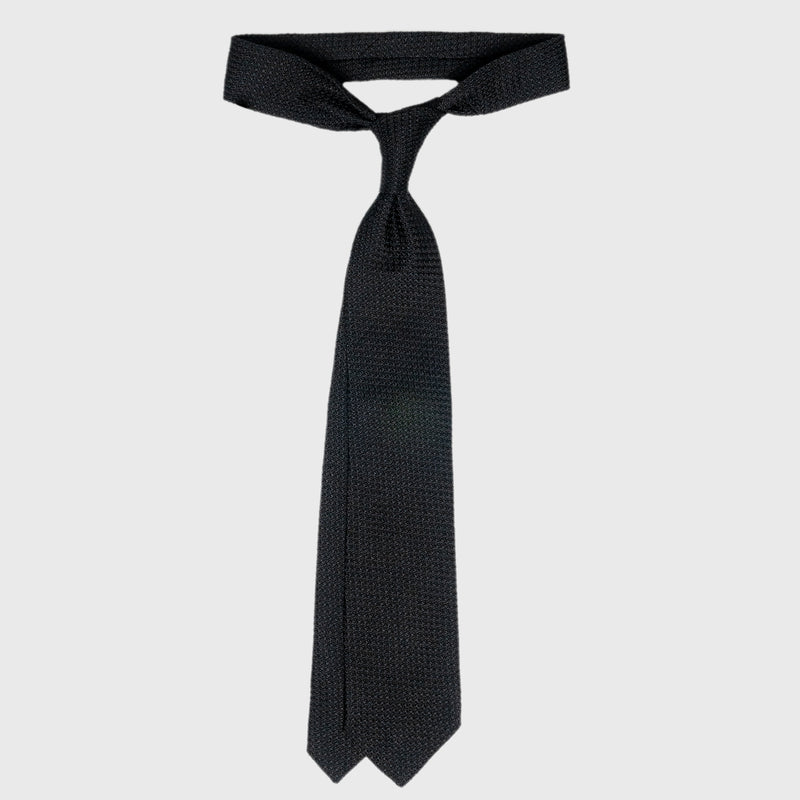 Black Grossa Grenadine tie tied in a classic knot, highlighting its elegant design.