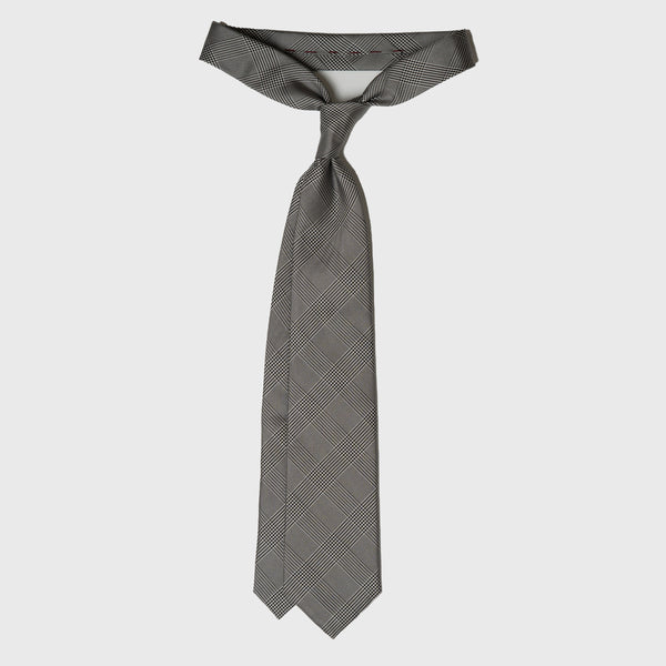 Black and white Glen plaid tie displayed in a loosely tied knot.