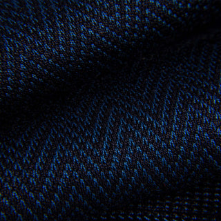 Close-up of blue and black chevron pattern on dress sock fabric.