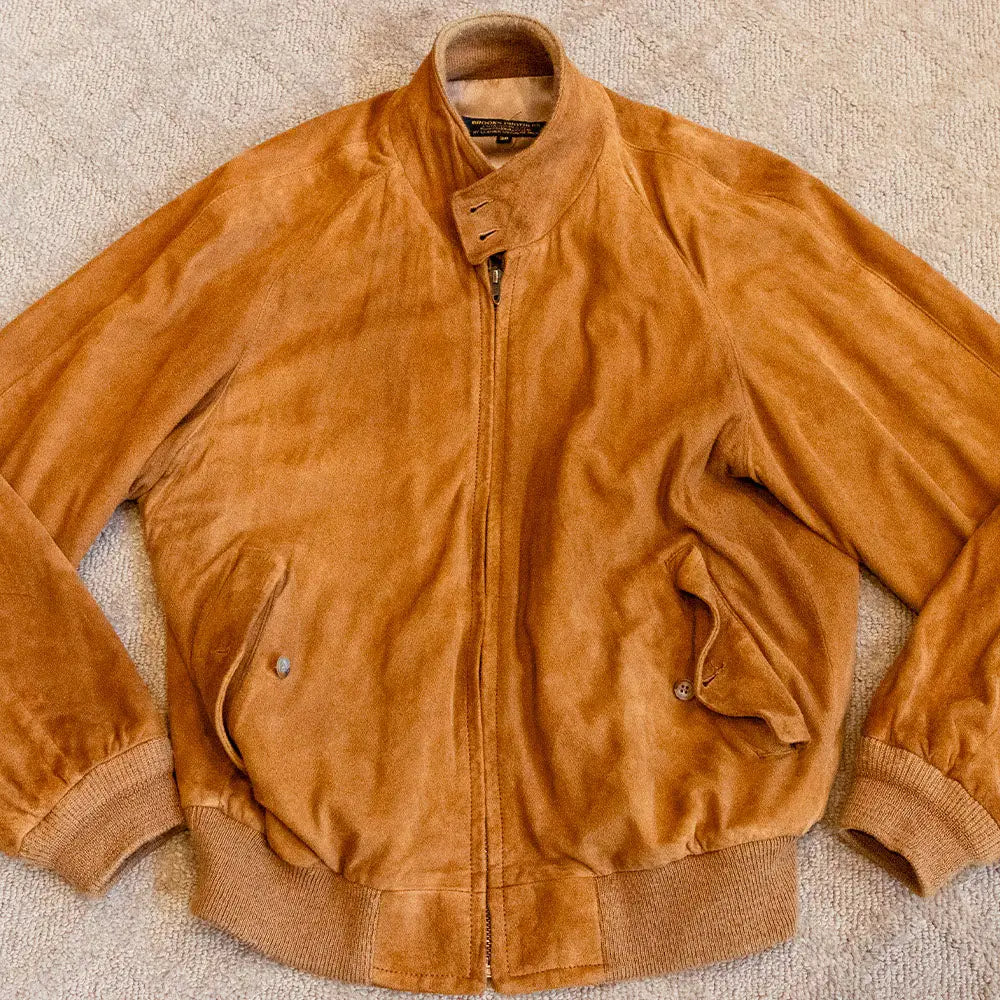 Brown suede bomber jacket showcasing Bruce Miller’s timeless style and classic fashion.