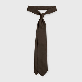 Brown Grenadine Tie untied, highlighting its luxurious Italian silk craftsmanship.