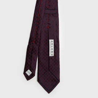 Back view of Burgundy and Navy Houndstooth Silk Tie showing label details.