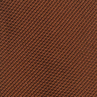 Close-up of burnt orange grenadine tie's intricate textured weave.