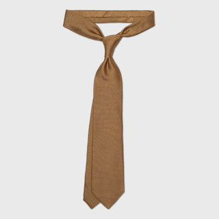 Champagne Grenadine tie, knotted four-in-hand.