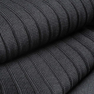 Close-up of ribbed texture on charcoal cotton dress socks for durability.