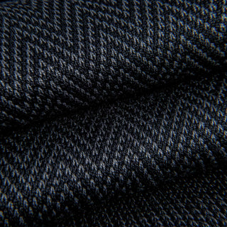 Close-up of grey and black chevron pattern on dress socks.