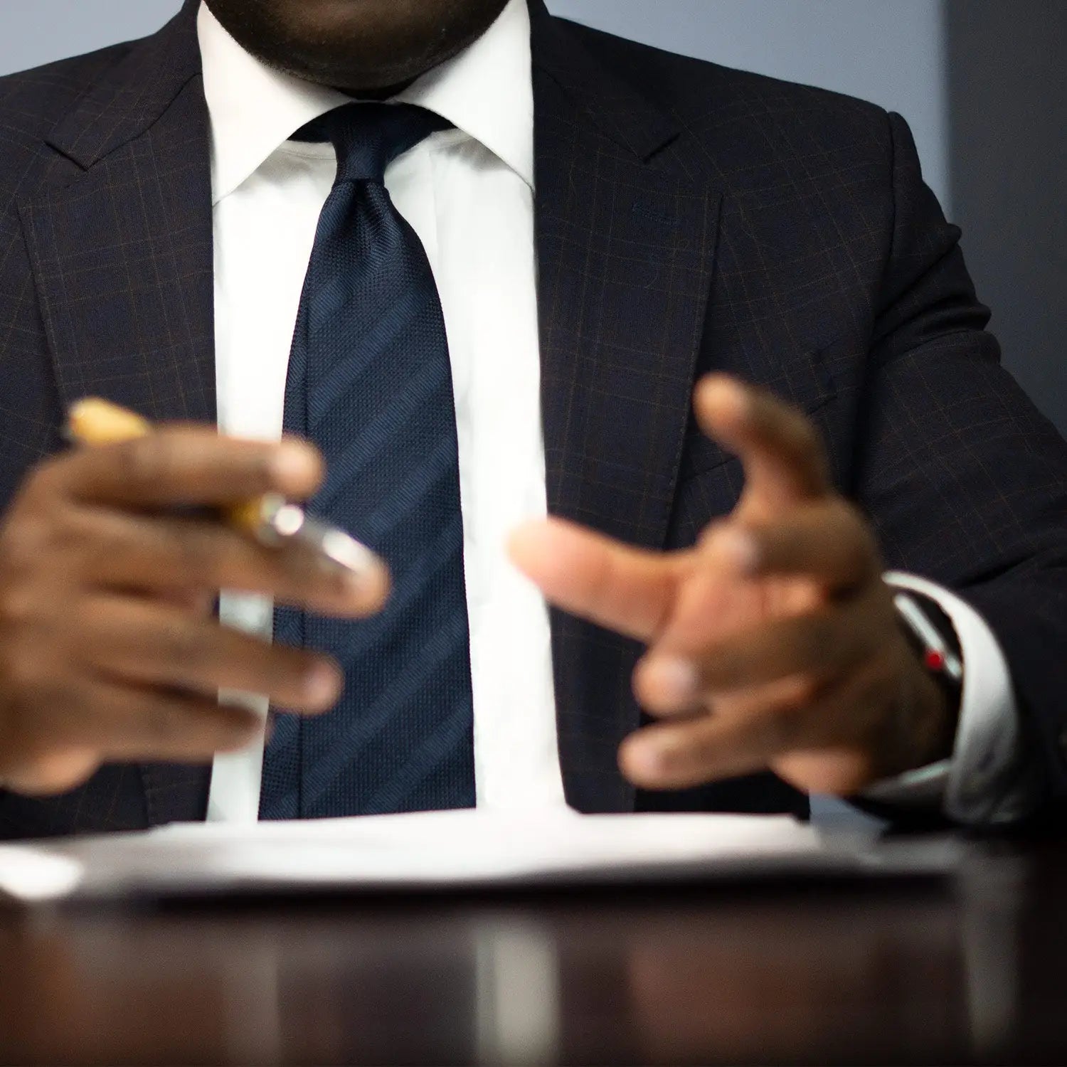 Business professional in grey suit showcasing professional outfits for curb appeal in real estate