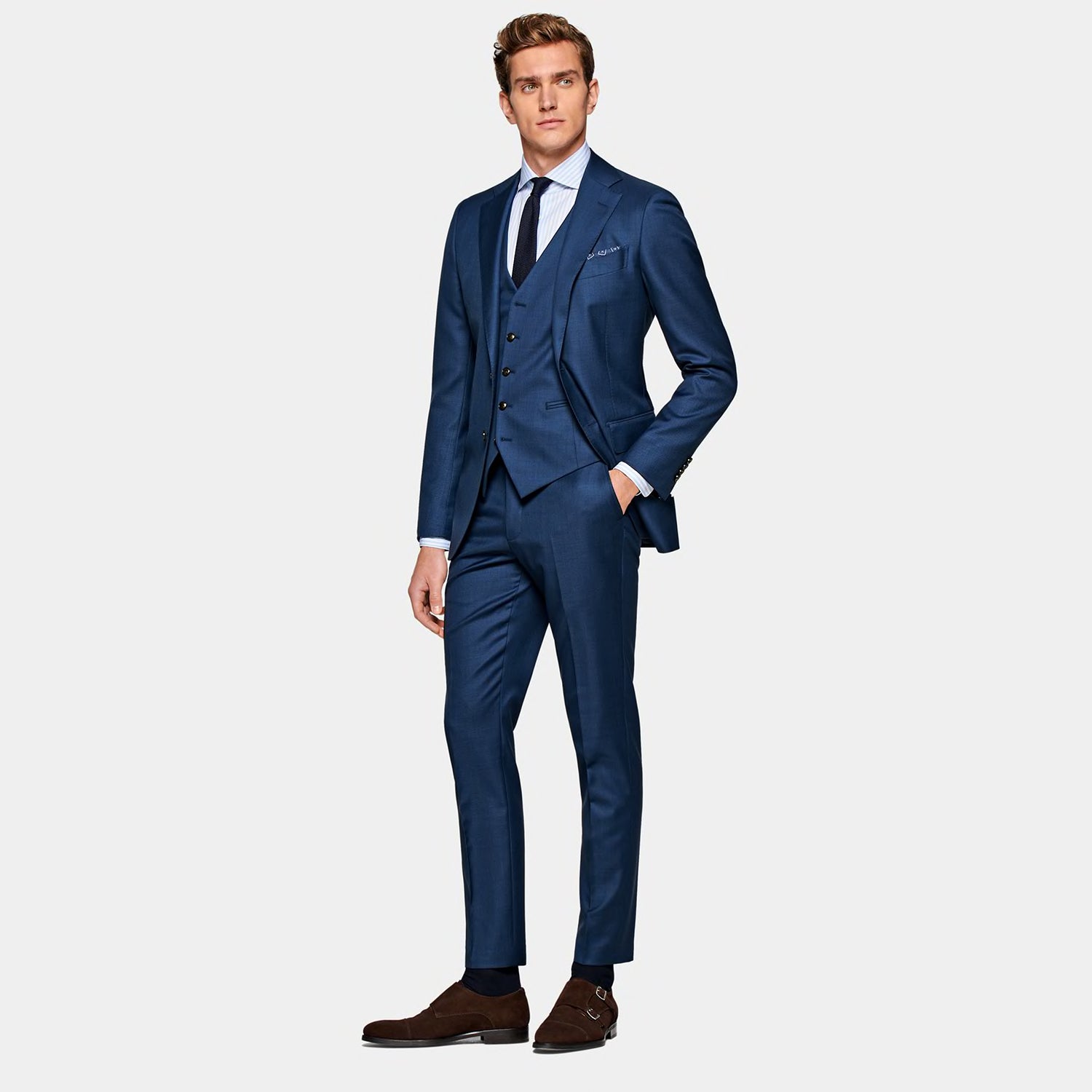 Blue three-piece suit ideal for your wedding day featuring forest green grenadine accents