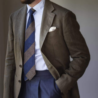 Full outfit featuring a light brown and French blue block striped grenadine tie with a blazer and trousers.