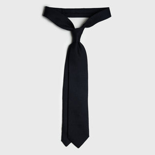 Midnight Blue Grenadine Tie in an untied position showcasing its length.