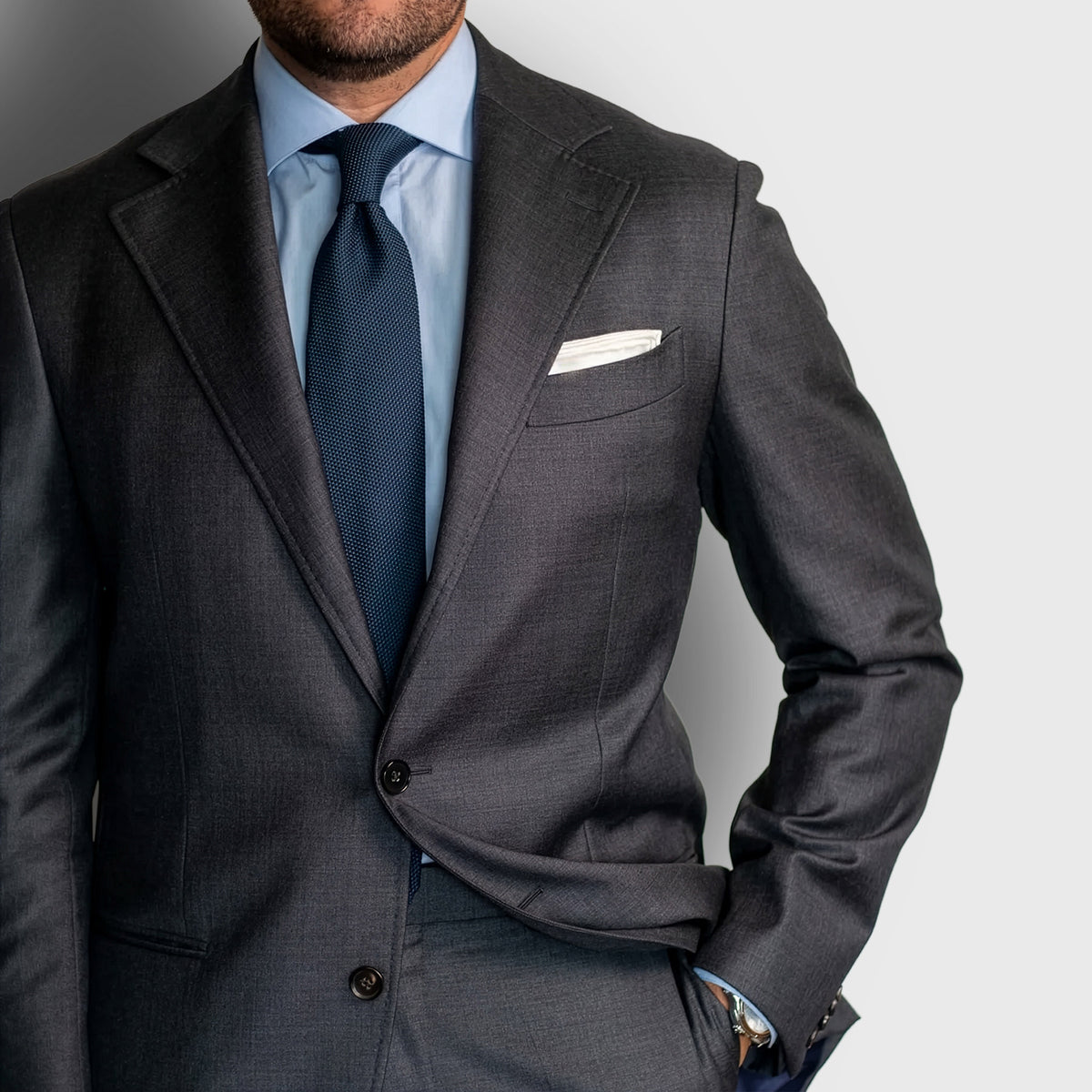 Navy Grenadine Tie worn with a charcoal suit and light blue shirt