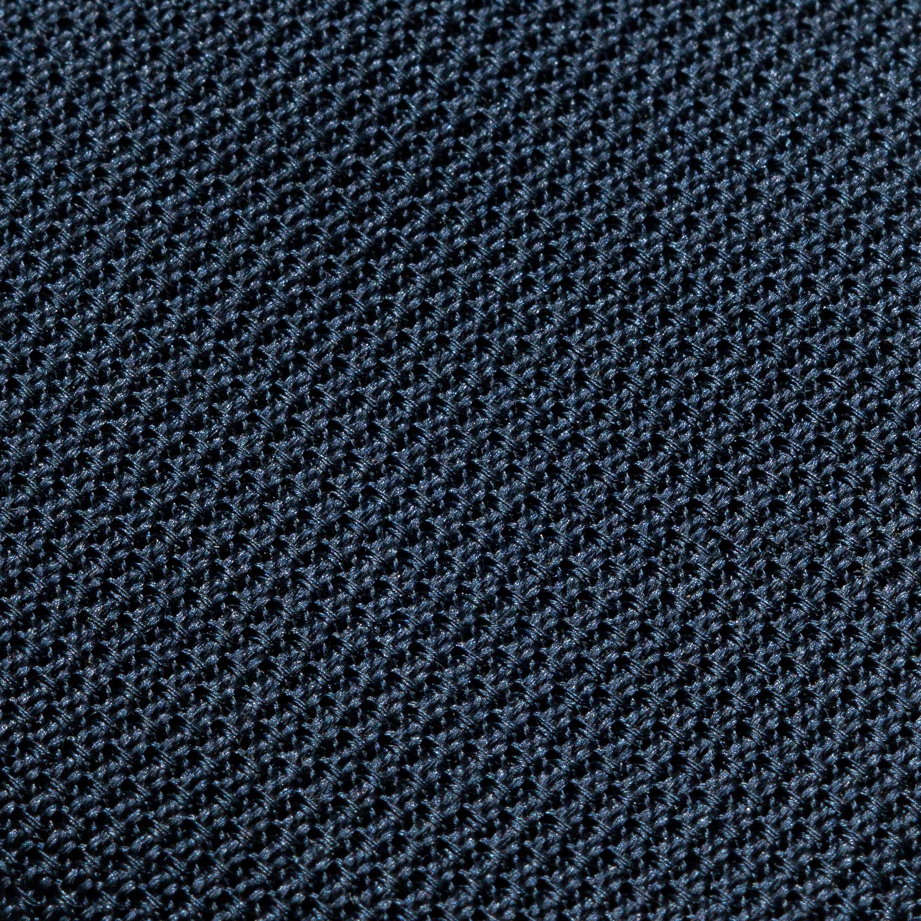 Macro close-up of the Navy Grenadine Tie weave, showing the textured open silk grain.