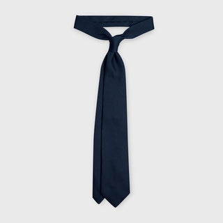 Navy grenadine tie made from premium Italian silk, displayed knotted.