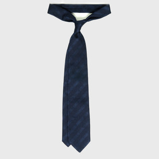 Navy blue grenadine tonal stripe tie displayed in a tied position.