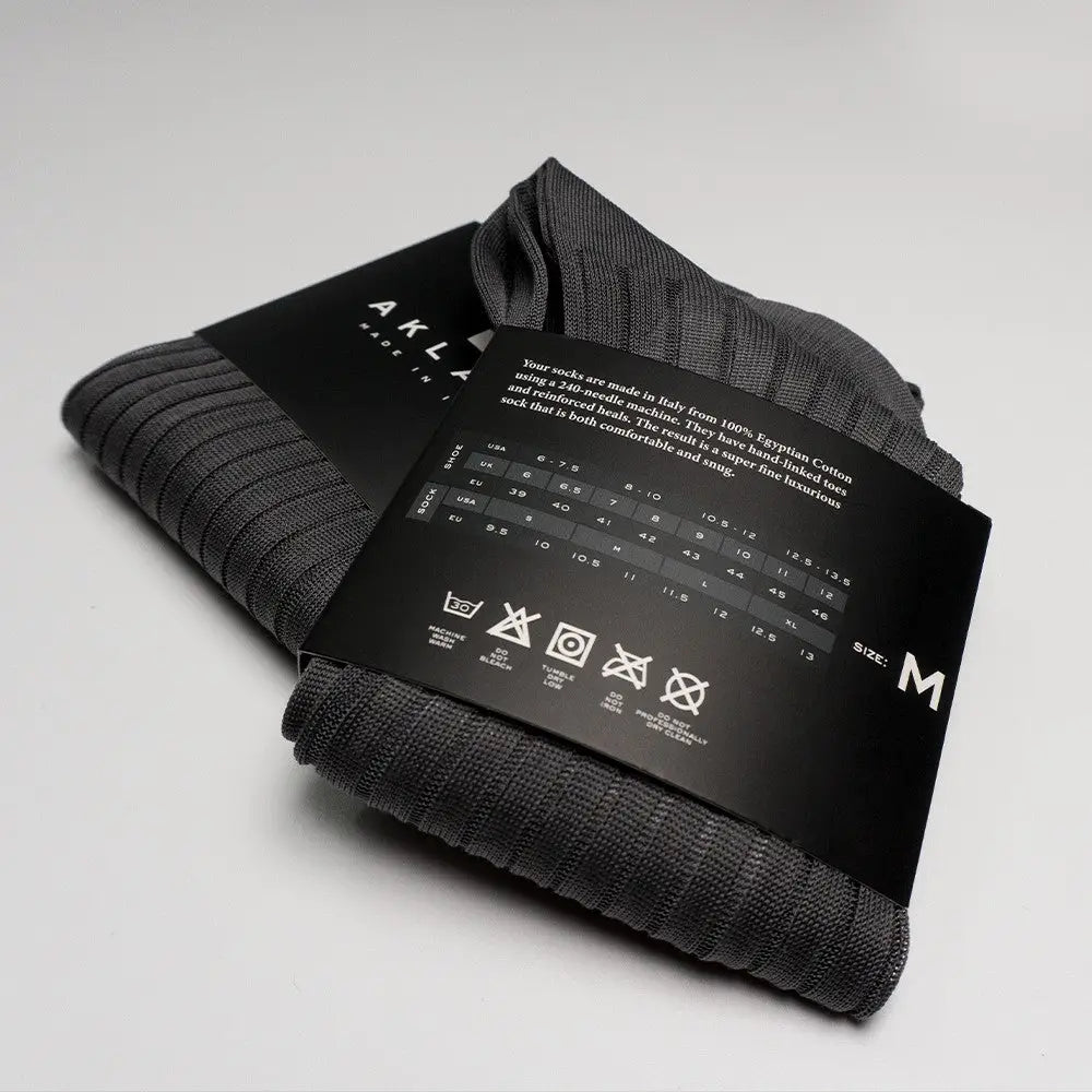 Gray ribbed dress socks with packaging for matching dress socks and stylish outfits