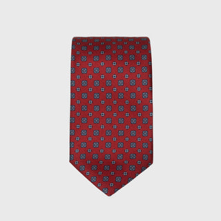 Deep red silk tie with blue floral foulard print, handmade in Italy.