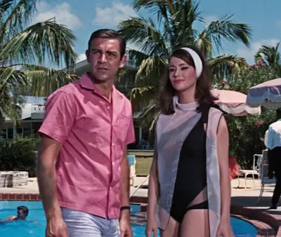 Sean Connery and woman in swimwear showcasing stylish men’s summer outfits