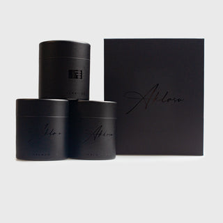 Elegant black packaging for the Essential Grenadine Tie Collection, featuring branded boxes.