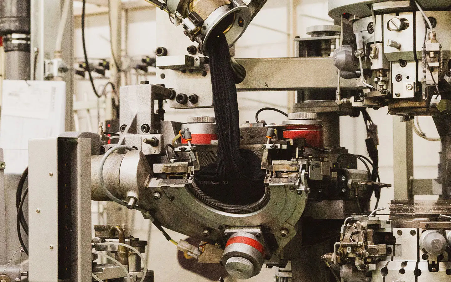 Industrial machinery illustrating the complexity of olive green dress socks craftsmanship