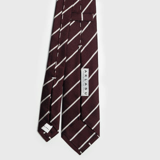 Back view of white striped deep burgundy six-fold tie showing label and stitching details.