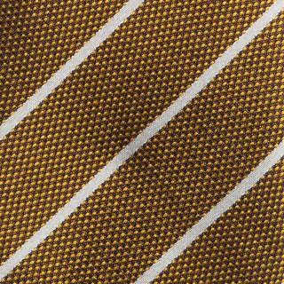 Detailed texture of white striped metallic gold silk tie fabric.