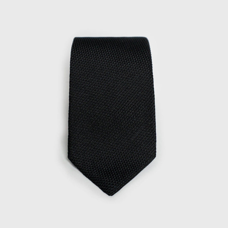 Classic black grenadine tie with a textured weave, perfect for formal occasions.