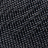 Detailed texture of black grenadine tie, emphasizing its intricate weave.