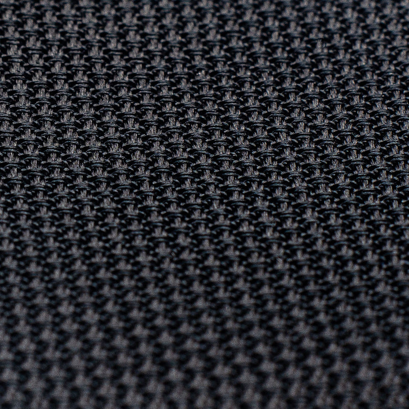 Detailed texture of black grenadine tie, emphasizing its intricate weave.