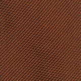 Close-up of burnt orange grenadine tie's intricate textured weave.