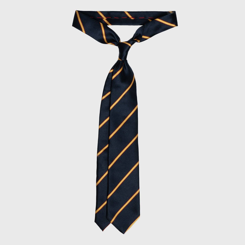 Gold and red striped navy blue tie tied in a classic knot, highlighting its six-fold craftsmanship.