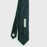Green and navy blue houndstooth six-fold silk tie, handcrafted in Italy, ideal for formal attire.