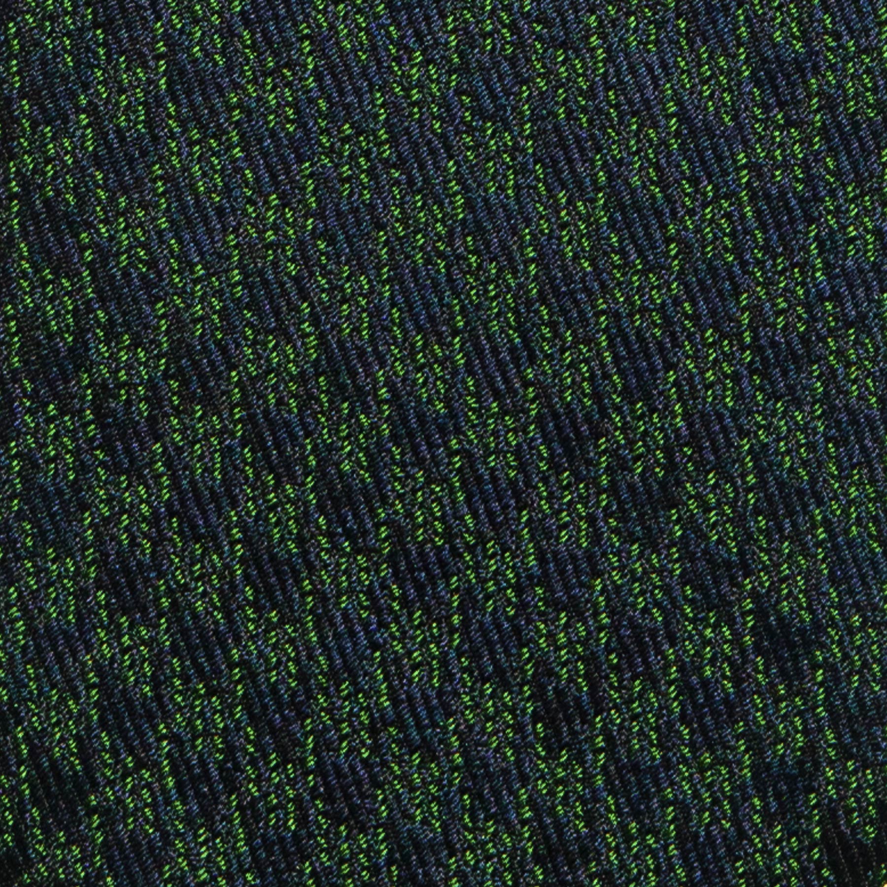 Navy blue and green houndstooth pattern on silk tie fabric.