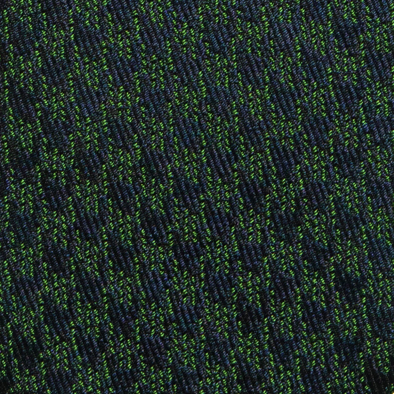 Navy blue and green houndstooth pattern on silk tie fabric.