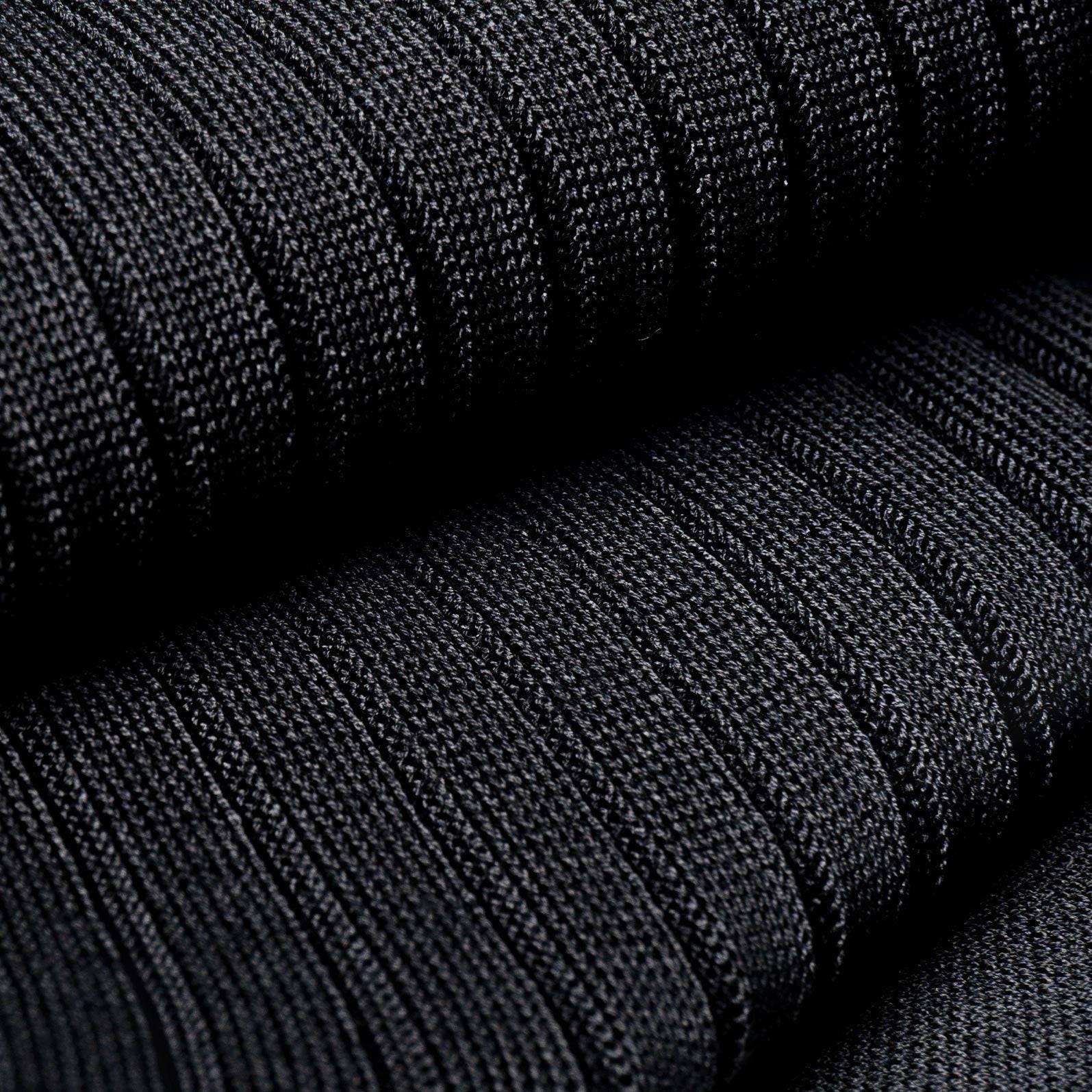 Close-up of black dress sock fabric — Egyptian Mako cotton ribbed texture