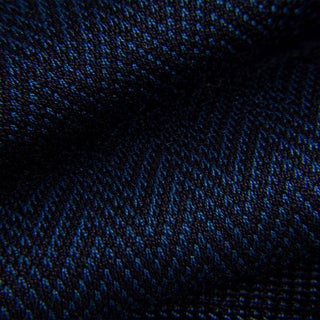 Close-up of blue and black chevron pattern on dress sock fabric.