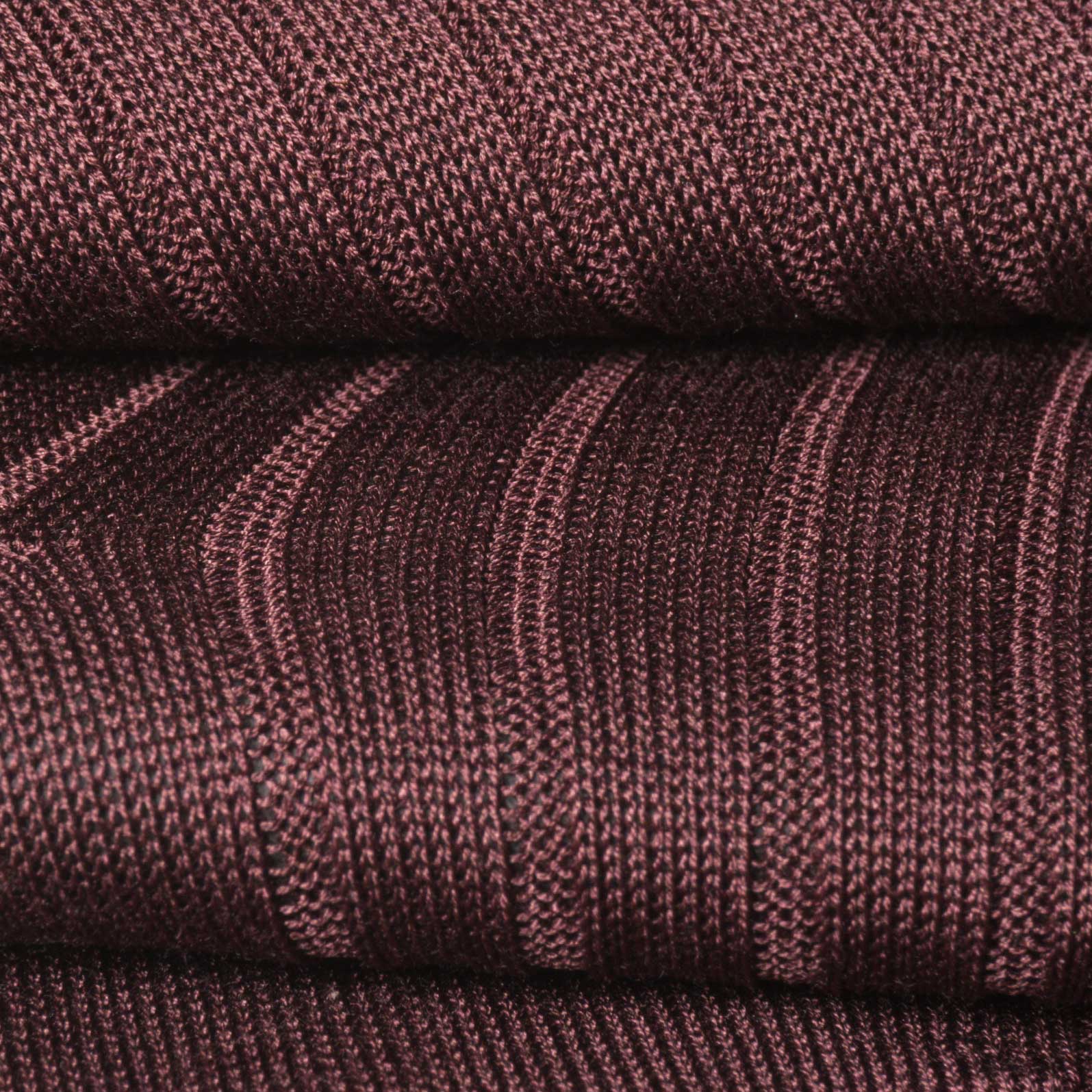 Close-up of burgundy dress sock fabric, fine ribbed Egyptian Mako cotton.