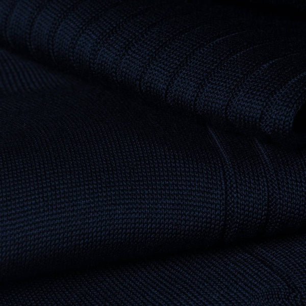 Close-up of dark blue dress sock fabric showcasing fine ribbed texture.