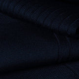 Close-up of dark blue ribbed cotton fabric for dress socks.