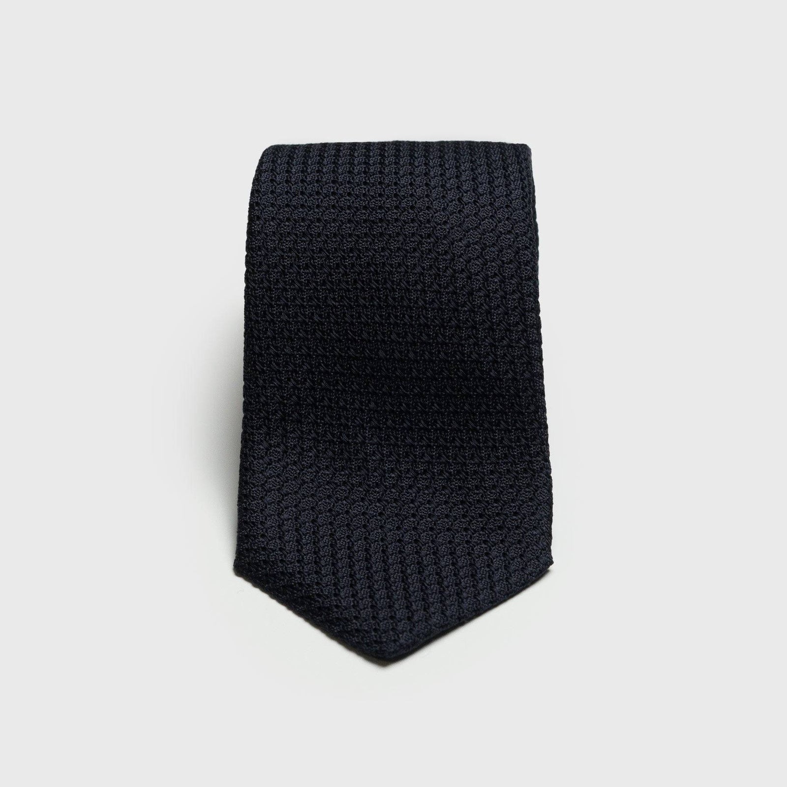 Midnight Blue Grossa Grenadine Tie with textured weave, folded neatly.