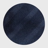 Close-up of navy blue grenadine fabric with tonal stripe texture.