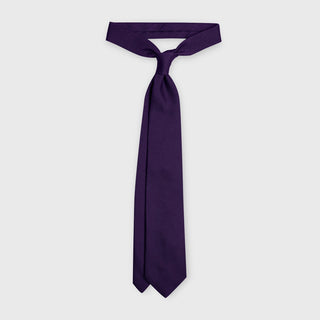 Purple grenadine tie made from premium Italian silk, displayed knotted.