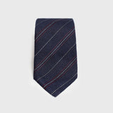 Red and white striped blue grenadine tie displayed flat.