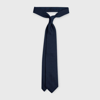 Navy grenadine tie made from premium Italian silk, displayed knotted.